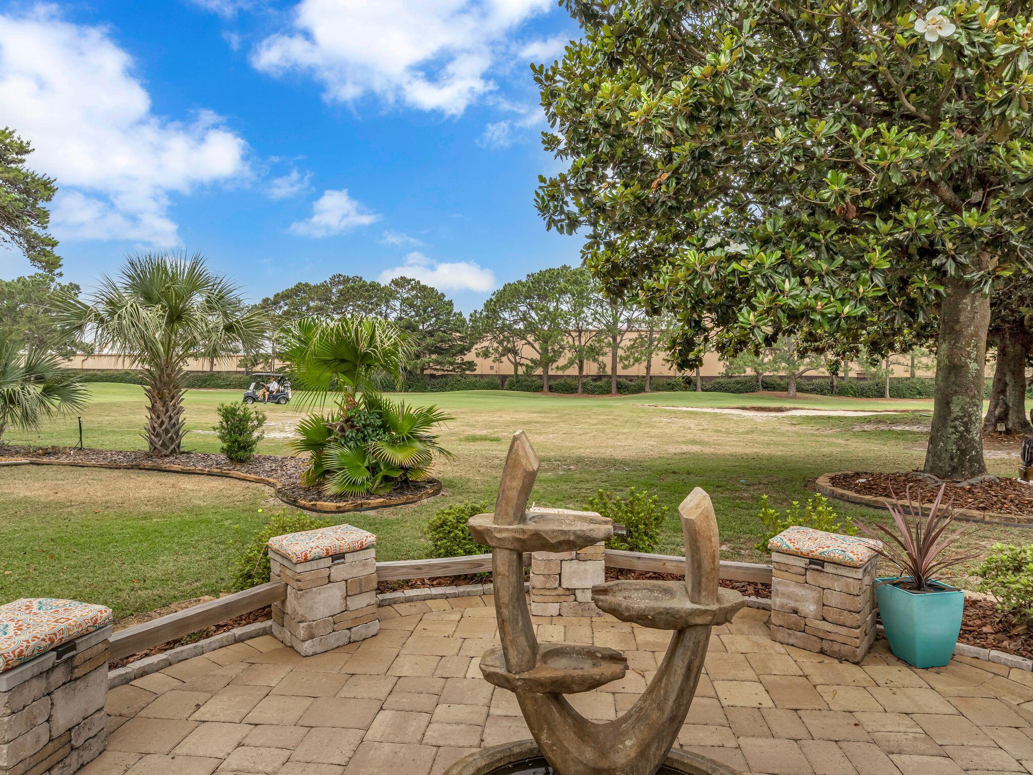 370 Golfview Drive Miramar Beach, FL 32550 - Photo 50 of 148 a view of a lake with table and chairs
