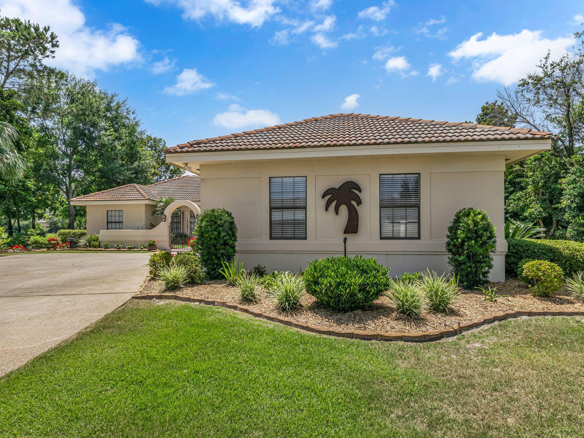 370 Golfview Drive Miramar Beach, FL 32550 - Photo 61 of 148 a front view of a house with a yard