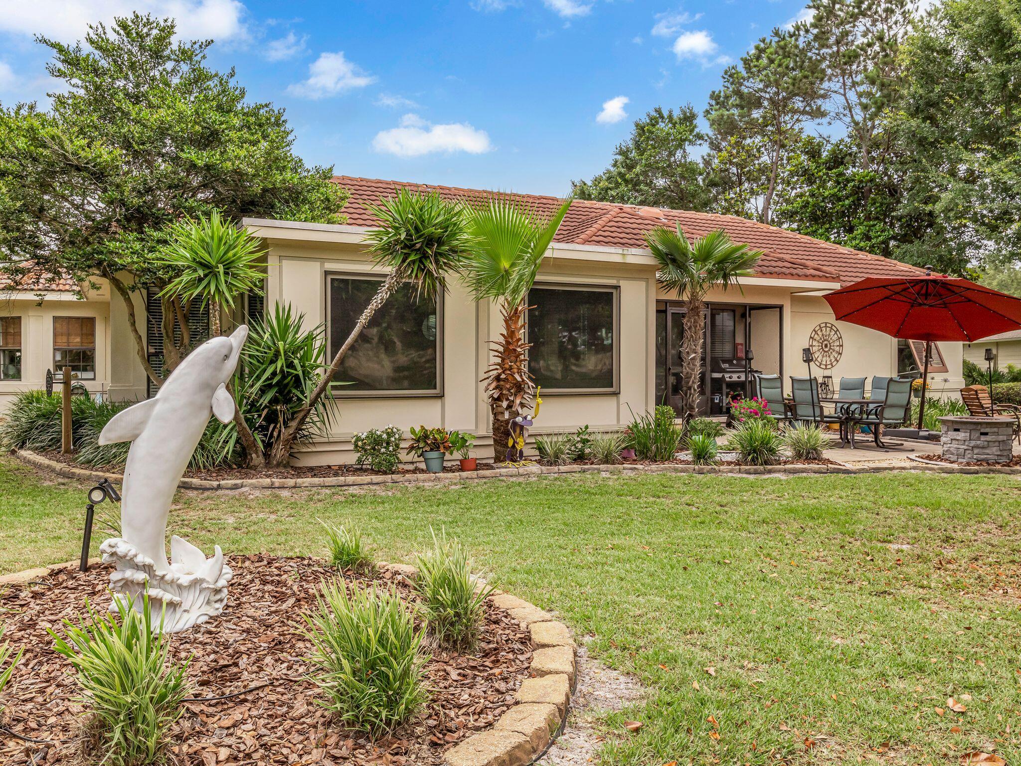 370 Golfview Drive Miramar Beach, FL 32550 - Photo 7 of 148 a front view of house with yard and outdoor seating