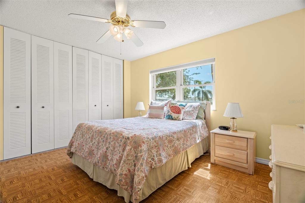 7701 Starkey Road, Unit 601 Seminole, FL 33777 - Photo 13 of 28 a bedroom with a bed and a window