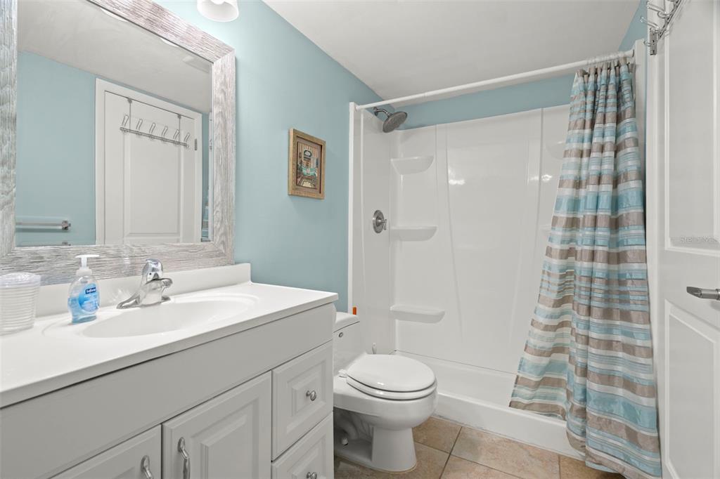 7701 Starkey Road, Unit 601 Seminole, FL 33777 - Photo 16 of 28 a bathroom with a sink a toilet and shower
