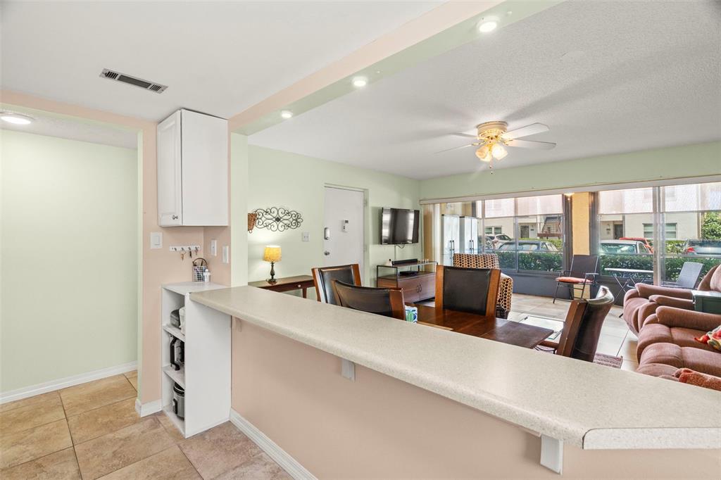 7701 Starkey Road, Unit 601 Seminole, FL 33777 - Photo 9 of 28 a living room with furniture and large windows