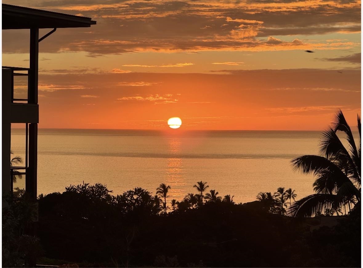 a sunset view with ocean view