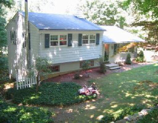 35 Virginia Court Ridgefield, CT 06877 - Photo 1 of 1 a view front of house with a yard