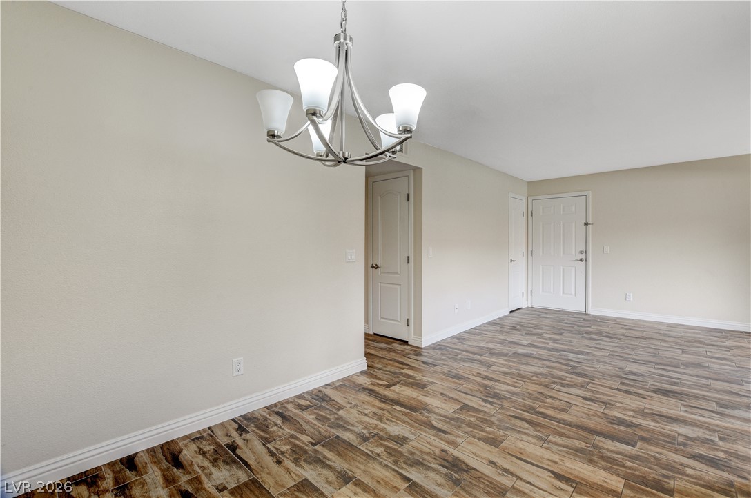 7200 West Pirates Cove Road, Unit 1026 Las Vegas, NV 89145 - Photo 11 of 35 This bright space features sleek flooring, creating an inviting atmosphere for daily living.