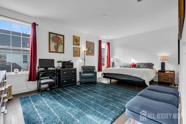 a bedroom with a bed and a desk