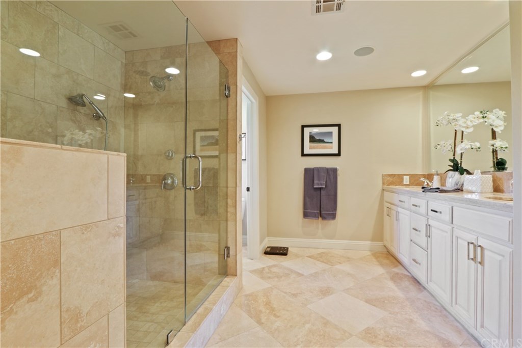 32682 7 Seas Drive Dana Point, CA 92629 - Photo 23 of 32 Master bath with large walk-in shower, double vanity with use of natural imported stones.