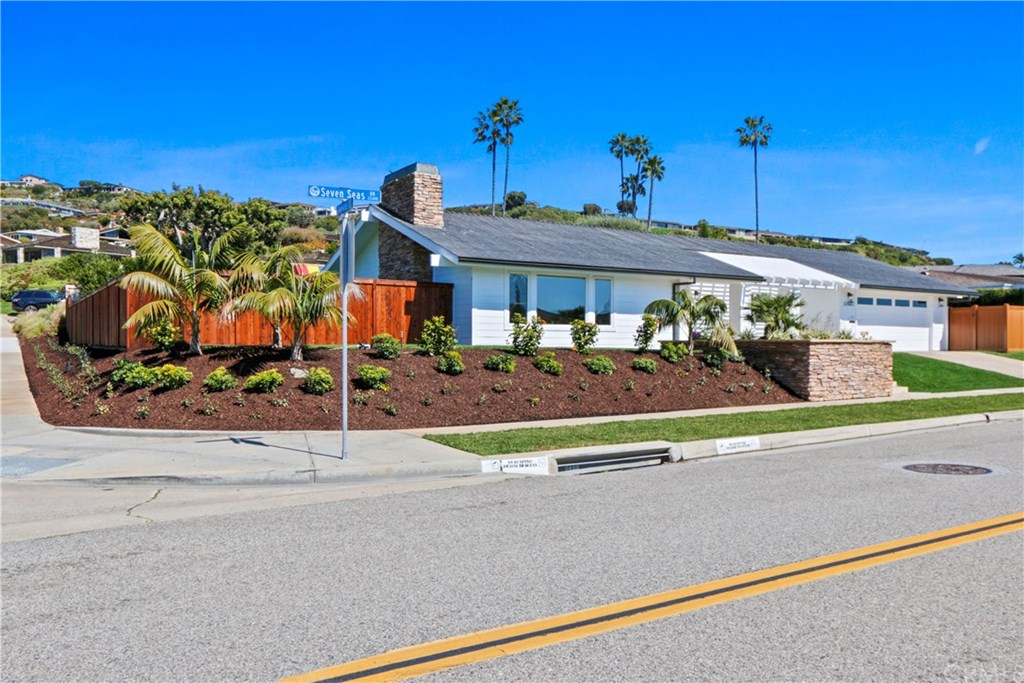 32682 7 Seas Drive Dana Point, CA 92629 - Photo 9 of 32 Stunning single level on a raised corner lot over 18000 sqf with great curb appeal with total privacy.