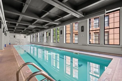 a view of a balcony with furniture