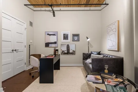 a work room with furniture and windows