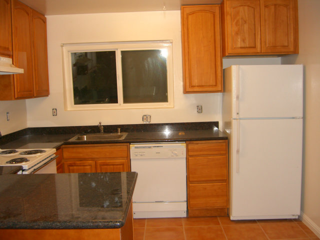17 Devonshire Boulevard San Carlos, CA 94070 - Photo 13 of 25 a kitchen with stainless steel appliances granite countertop a refrigerator and a stove