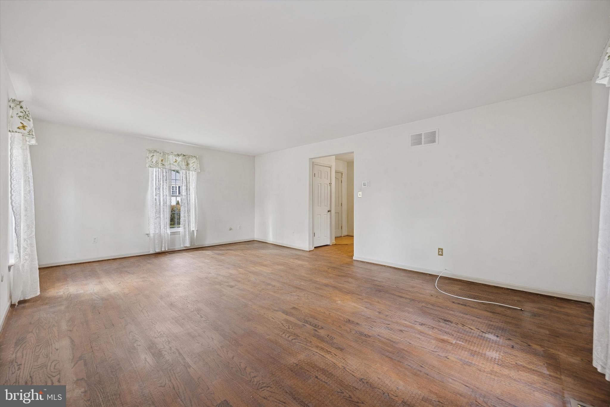 9 Hansen Court Narberth, PA 19072 - Photo 13 of 29 a view of an empty room with wooden floor and a window