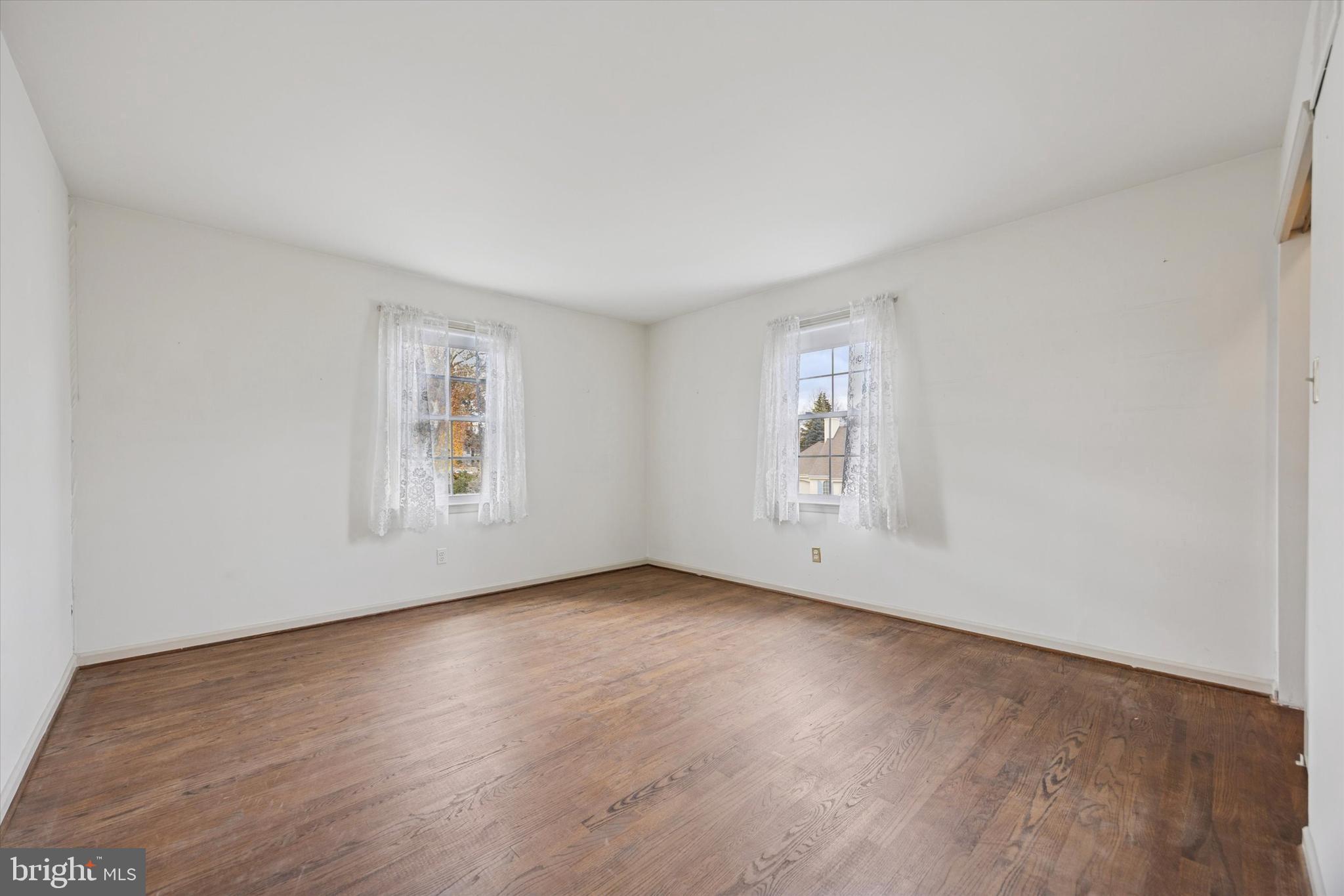9 Hansen Court Narberth, PA 19072 - Photo 19 of 29 a view of an empty room with wooden floor and a window