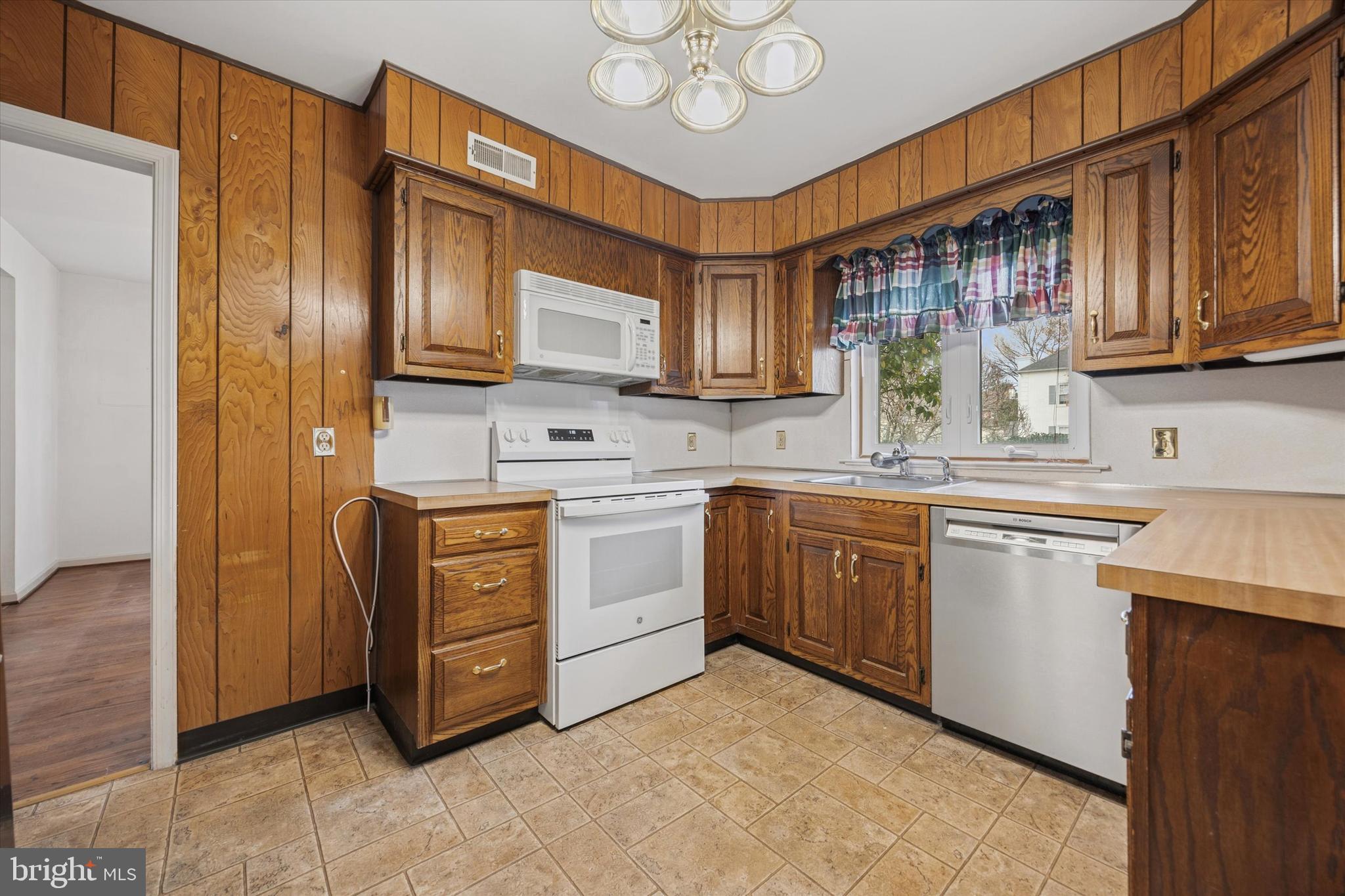 9 Hansen Court Narberth, PA 19072 - Photo 7 of 29 a kitchen with stainless steel appliances granite countertop a refrigerator a stove top oven a sink and dishwasher
