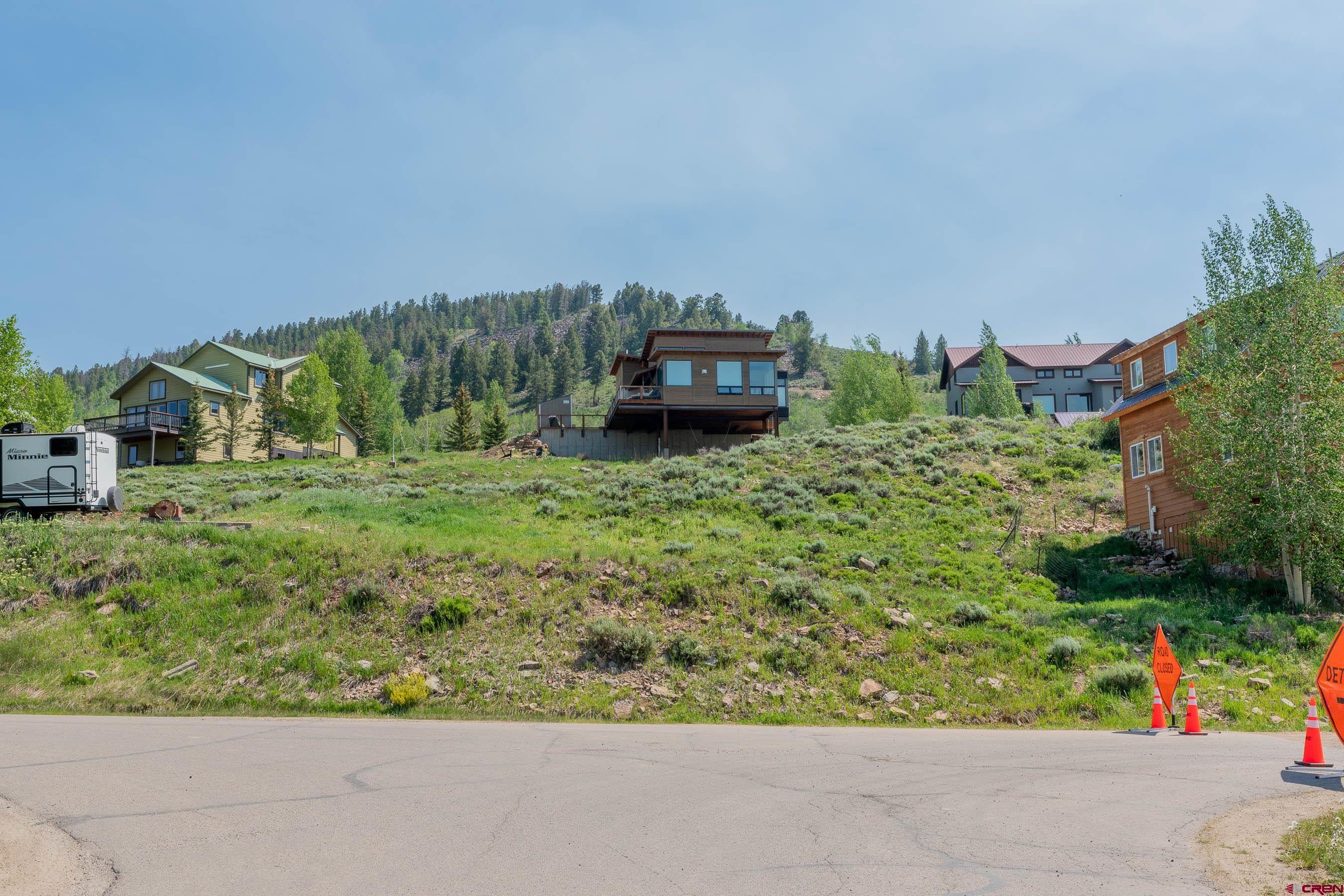 141 Haverly Street Crested Butte, CO 81224 - Photo 17 of 25 a backyard of a house with lots of green space