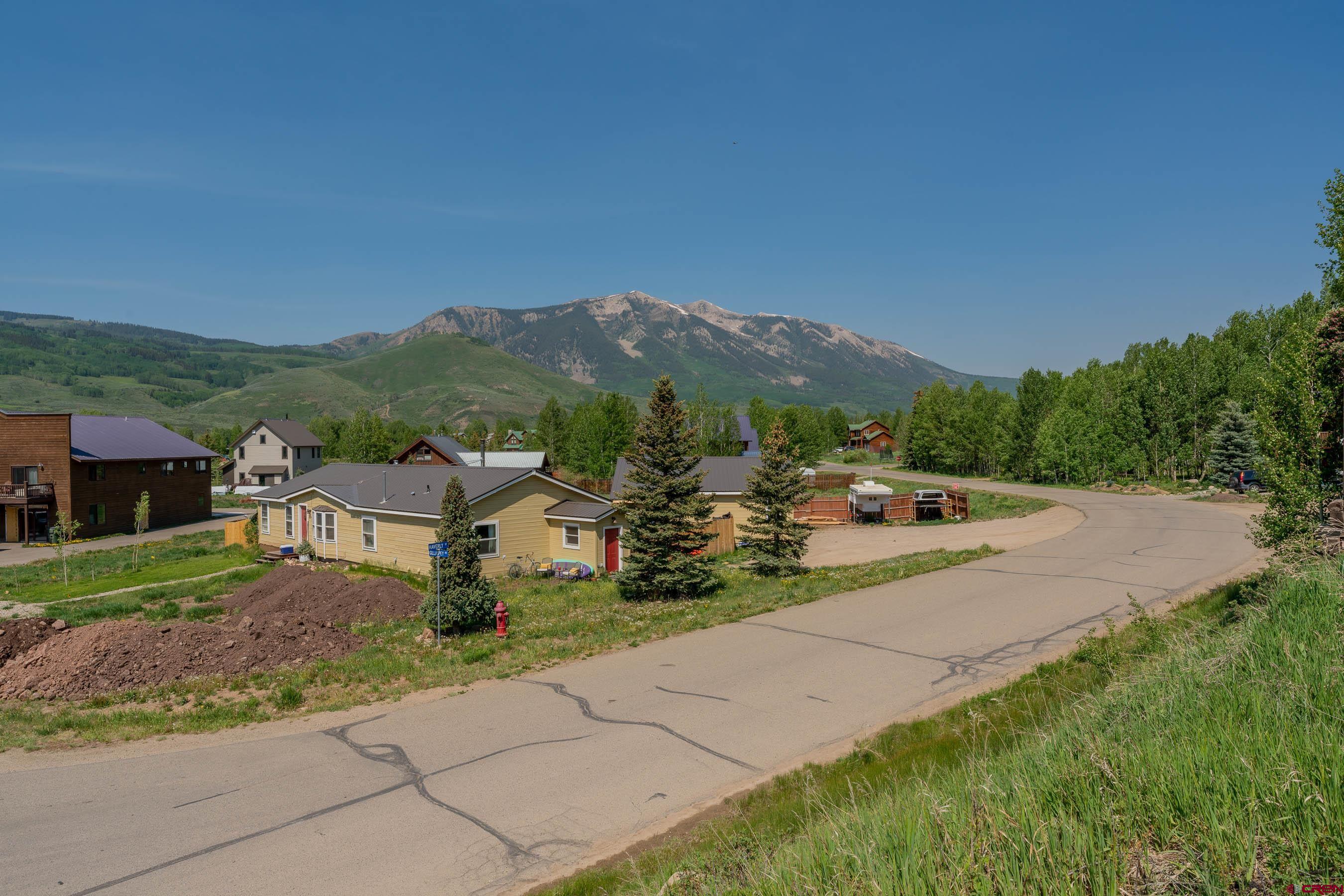 141 Haverly Street Crested Butte, CO 81224 - Photo 6 of 25 a view of a street with a houses in the background