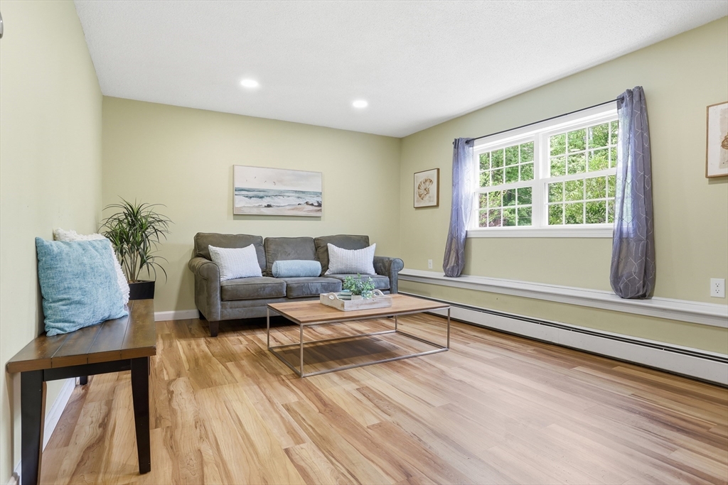 33 Simon Willard Road Acton, MA 01720 - Photo 26 of 42 a living room with furniture and a window