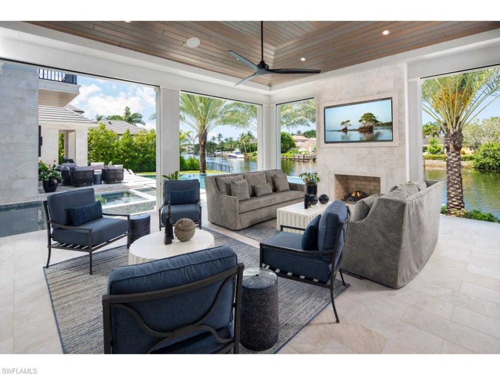 3200 Gin Lane Naples, FL 34102 - Photo 13 of 20 a living room with furniture and a large window