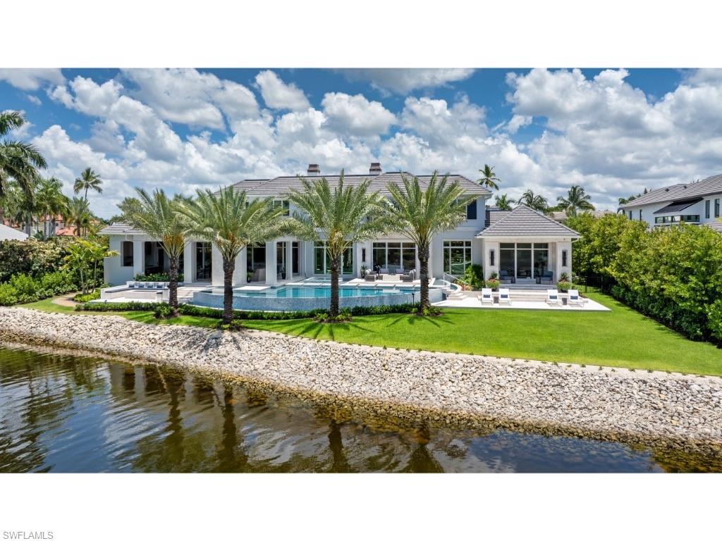 3200 Gin Lane Naples, FL 34102 - Photo 17 of 20 a view of a house with a swimming pool