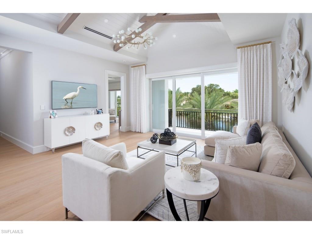 3200 Gin Lane Naples, FL 34102 - Photo 8 of 20 a living room with furniture and a large window