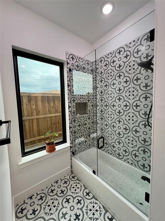 613 Wildcat Way Kennedale, TX 76060 - Photo 23 of 38 Bathroom featuring tile patterned flooring and bathing tub / shower combination