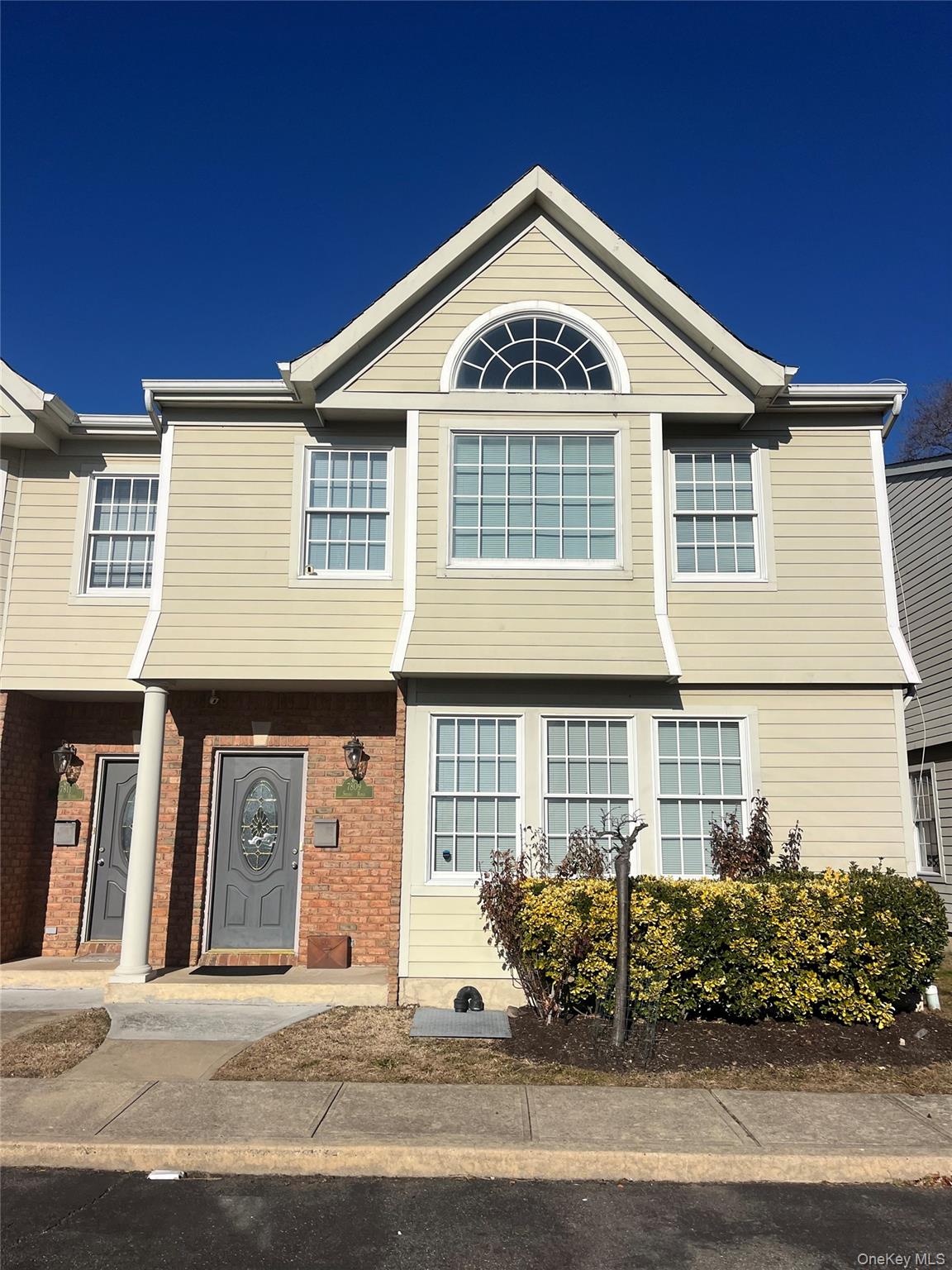 7809 Shore, Unit 7809 Port Washington, NY 11050 - Photo 2 of 4 a front view of a house