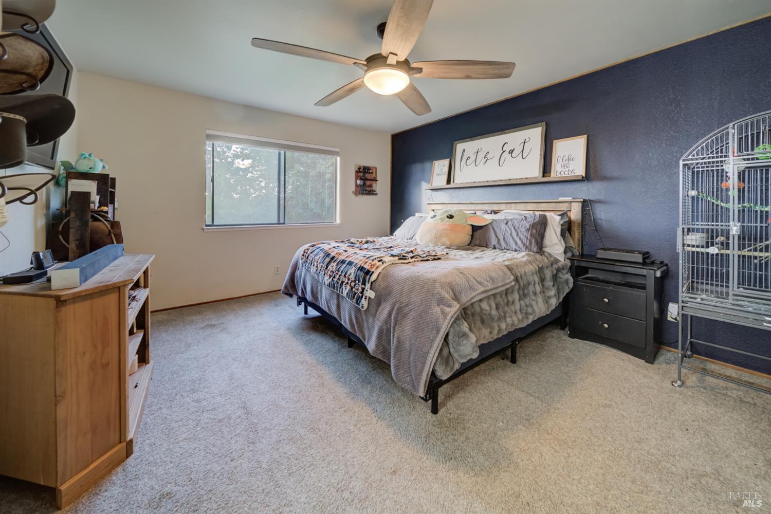 989 Suffolk Way Fairfield, CA 94533 - Photo 24 of 30 a bedroom with a bed and a chandelier