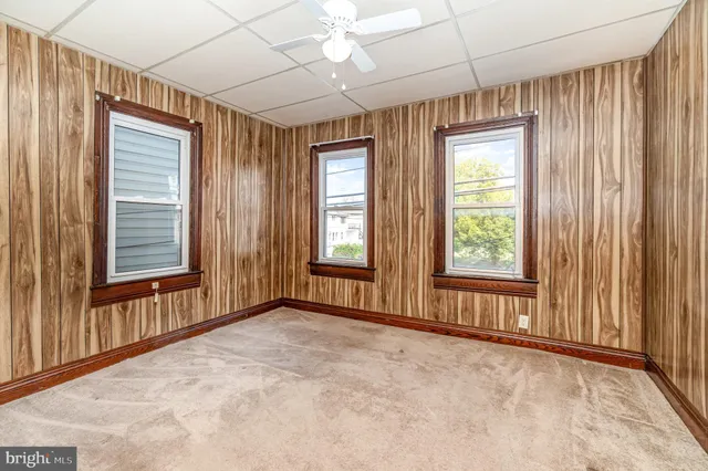 an empty room with a outdoor space and a shower curtain