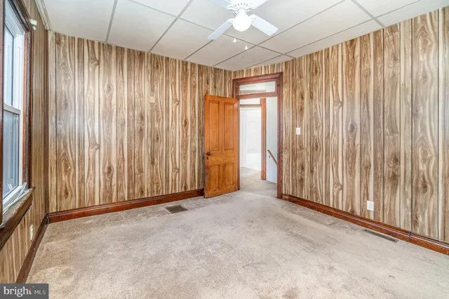 a bathroom with a toilet sink and window
