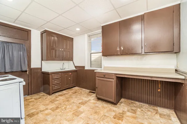 a kitchen with a stove and a refrigerator
