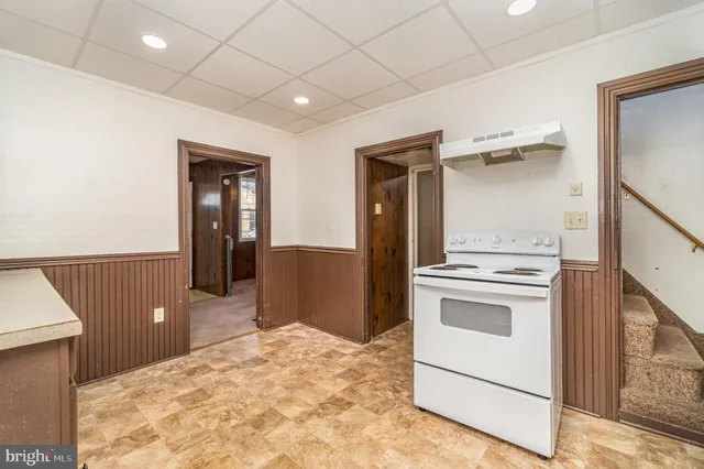 a spacious bathroom with a sink vanity and mirror