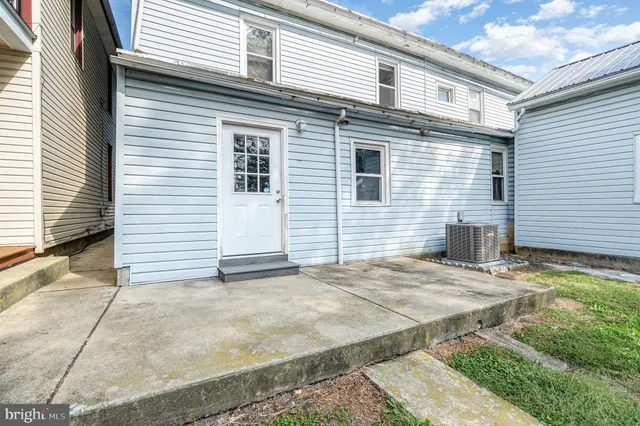 a view of a backyard with a garden and trees