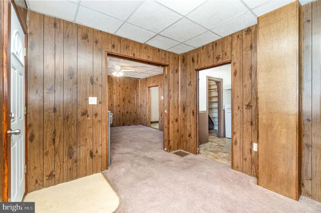 a view of a bathroom with glass door and shower
