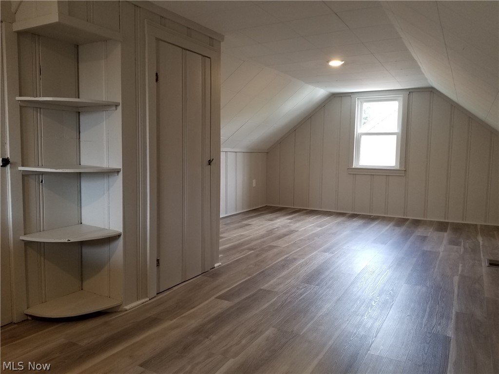 5671 Wellington Road Cleveland, OH 44124 - Photo 14 of 26 Additional living space with lofted ceiling and hardwood / wood-style floors