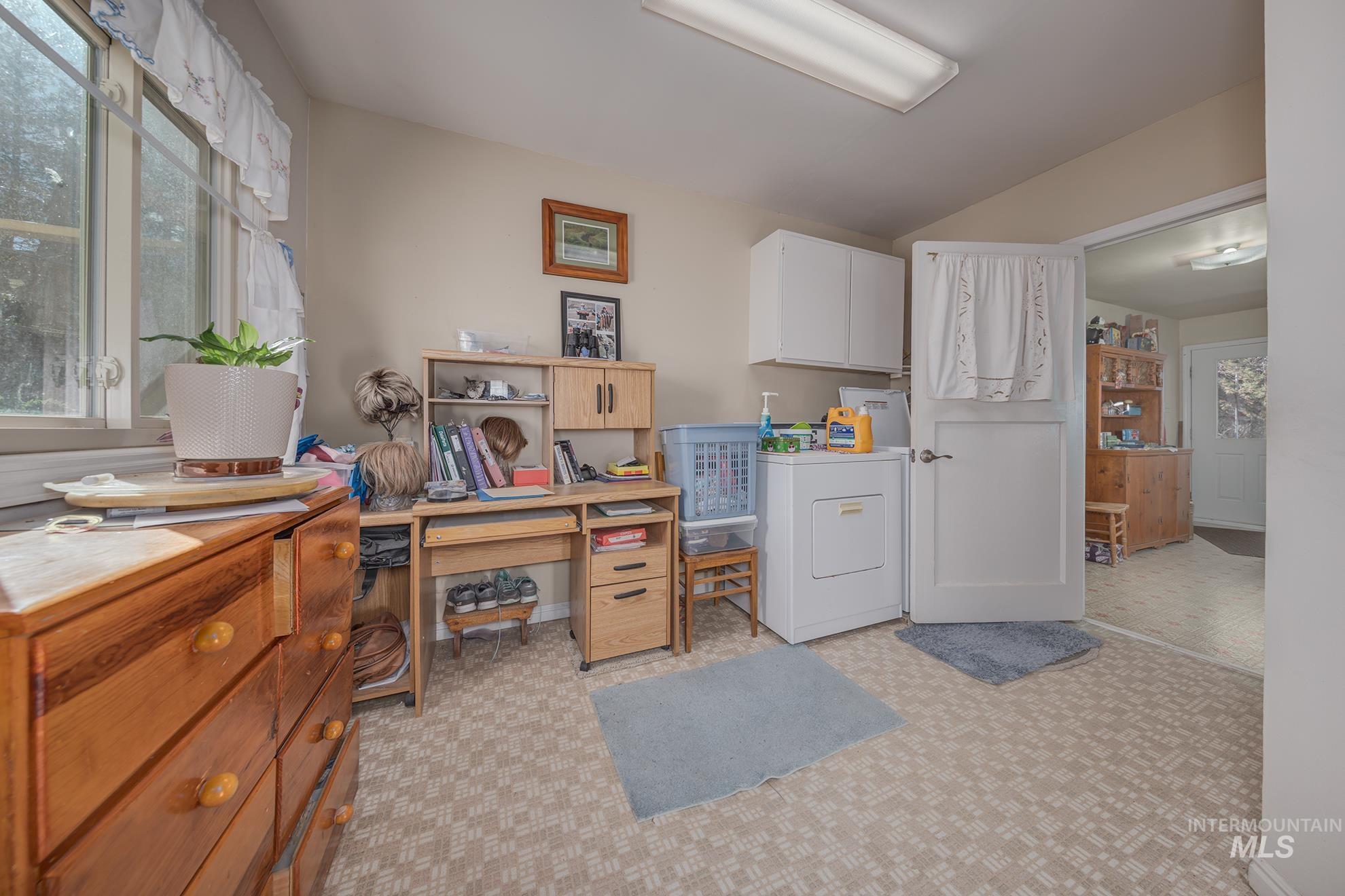 1365 Highway 95 Weiser, ID 83672 - Photo 12 of 34 Laundry room featuring plenty of natural light, an office area, cabinet space, and washer / dryer