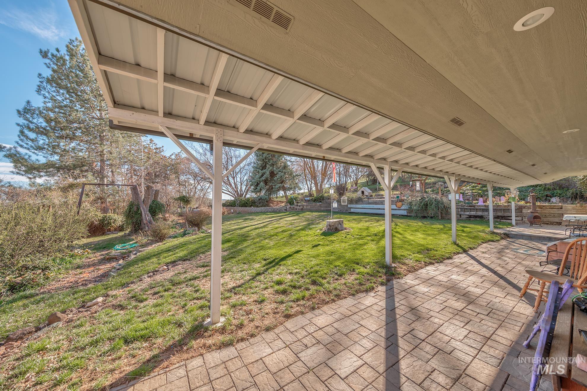 1365 Highway 95 Weiser, ID 83672 - Photo 20 of 34 Fenced backyard with a patio area