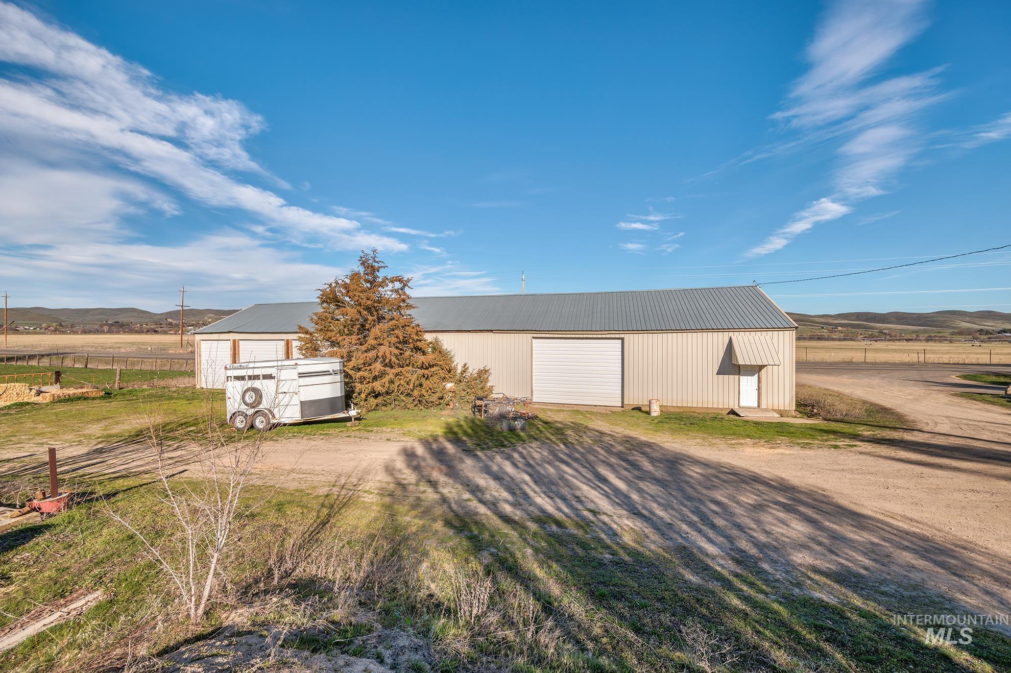 1365 Highway 95 Weiser, ID 83672 - Photo 22 of 34 View of outbuilding with a mountain view, a view of rural / pastoral area, and driveway