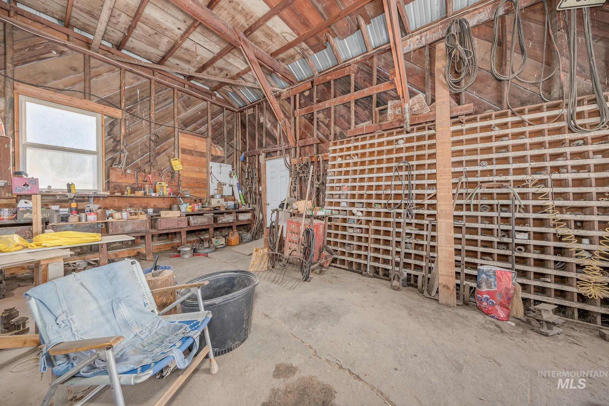 1365 Highway 95 Weiser, ID 83672 - Photo 24 of 34 Miscellaneous room with a workshop area and unfinished concrete floors