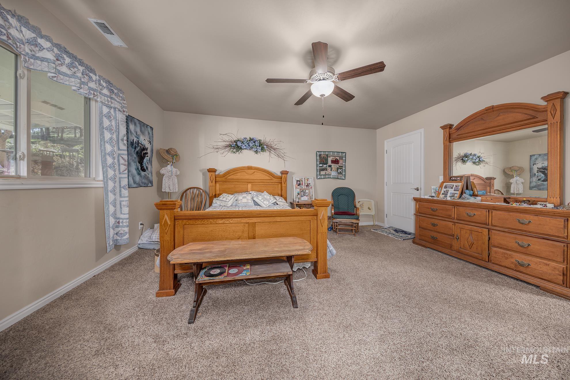 1365 Highway 95 Weiser, ID 83672 - Photo 10 of 34 Bedroom featuring light colored carpet and ceiling fan