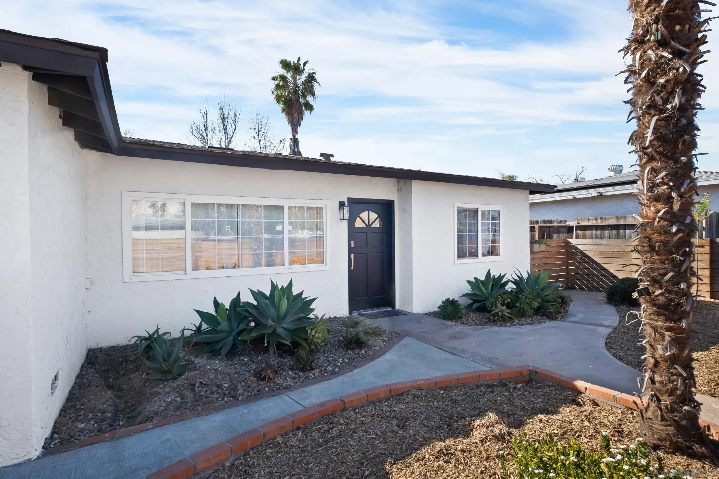 9651 Maccool Lane Santee, CA 92071 - Photo 1 of 32 a front view of a house with garden