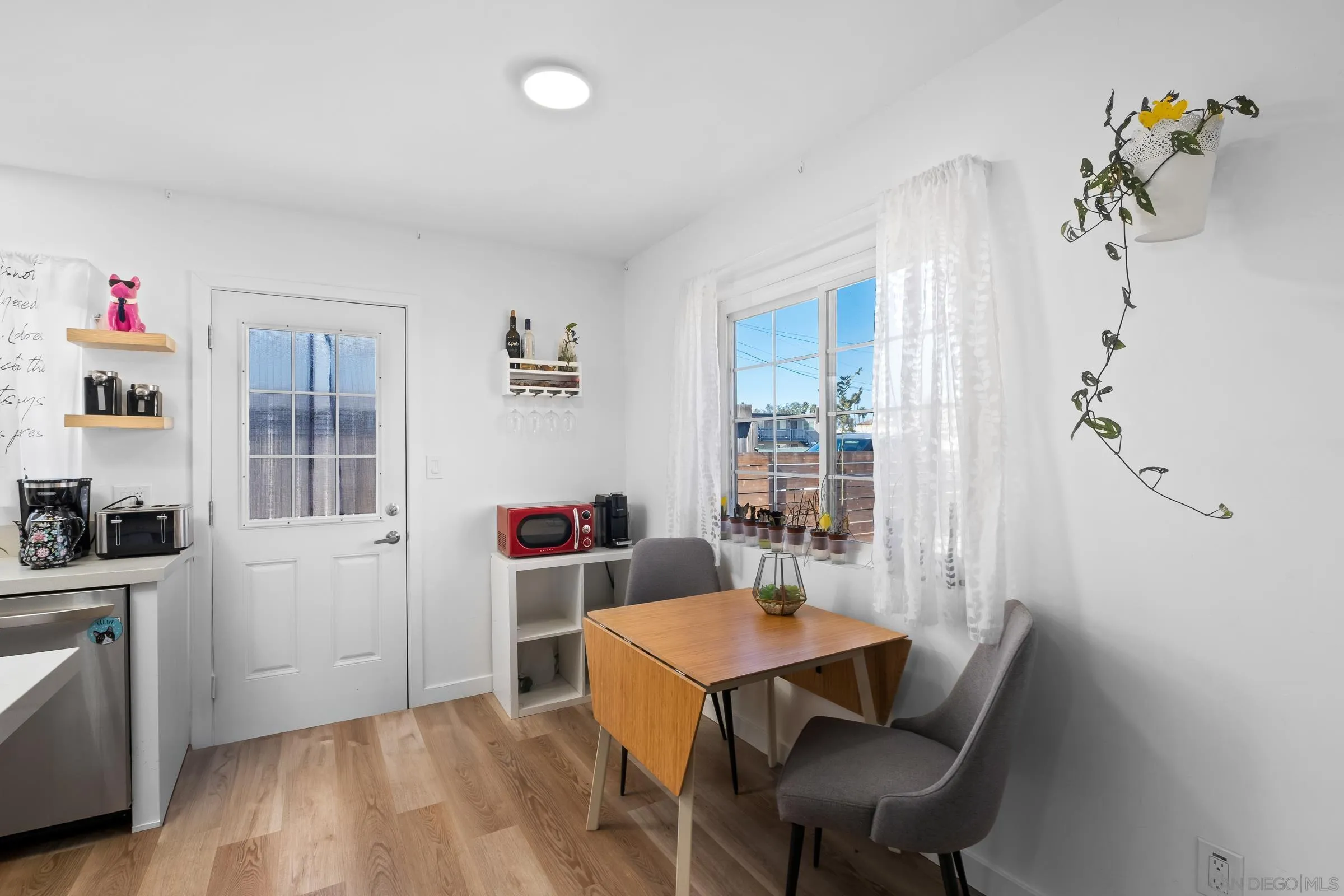 9651 Maccool Lane Santee, CA 92071 - Photo 14 of 32 a view of a dining room with furniture and wooden floor