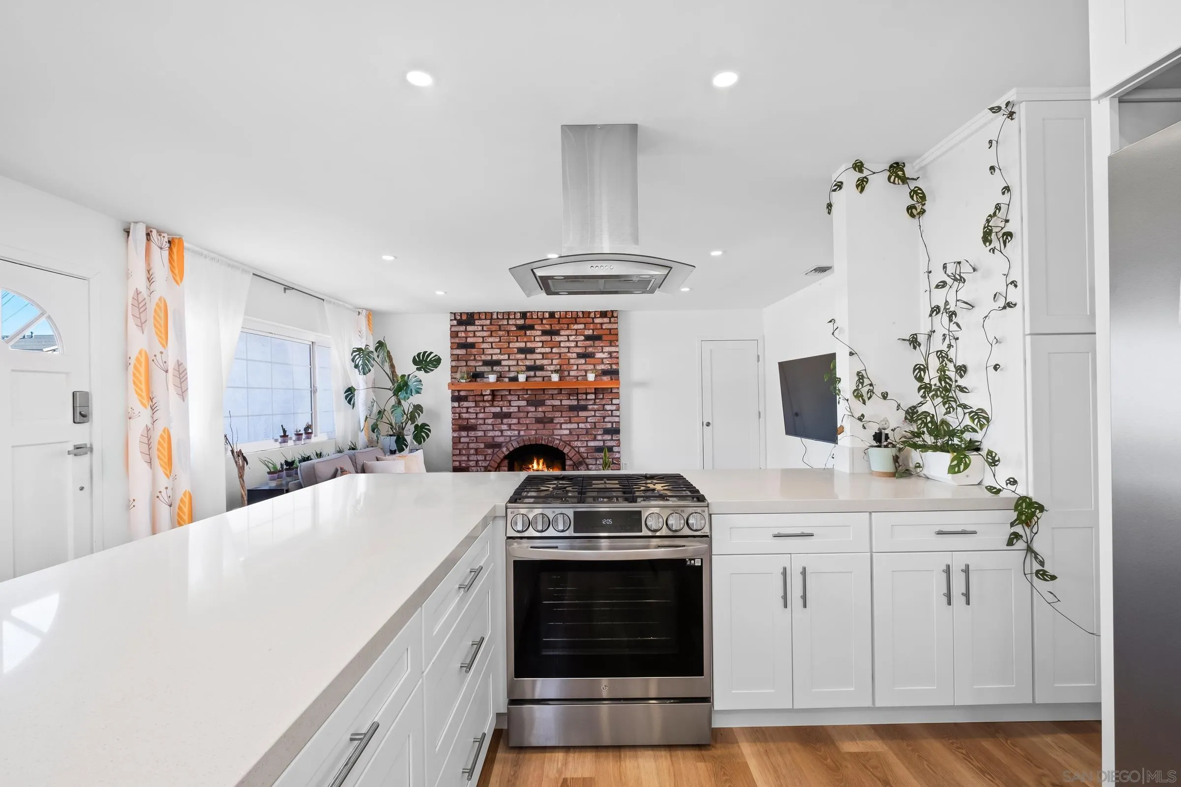 9651 Maccool Lane Santee, CA 92071 - Photo 15 of 32 a kitchen with stainless steel appliances a stove a sink and a refrigerator