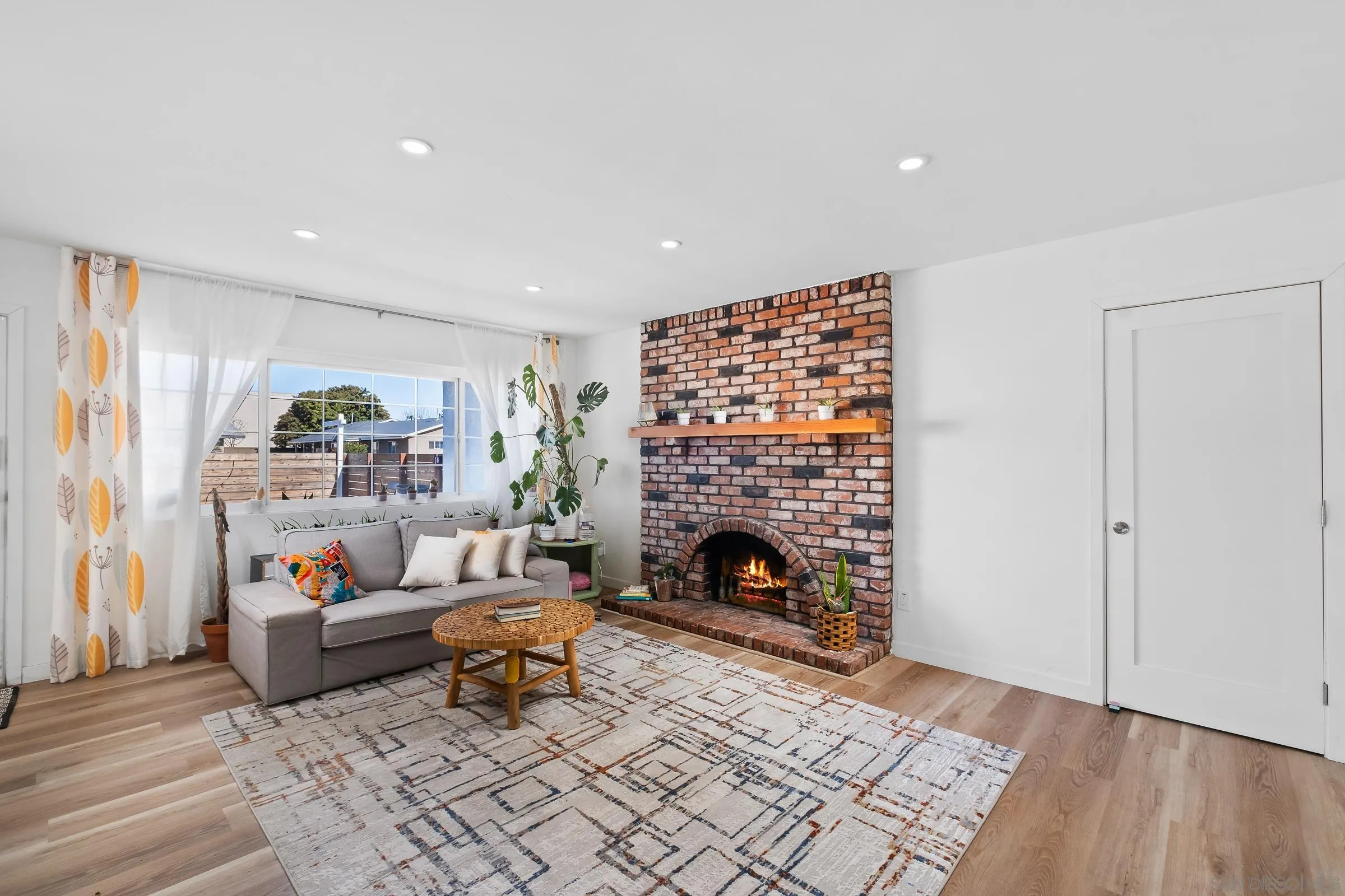 9651 Maccool Lane Santee, CA 92071 - Photo 16 of 32 a living room with furniture and a fireplace