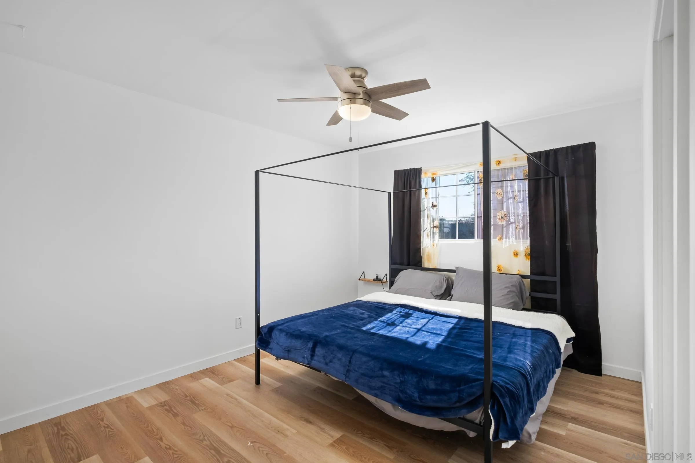 9651 Maccool Lane Santee, CA 92071 - Photo 20 of 32 a bedroom with a bed and a mirror