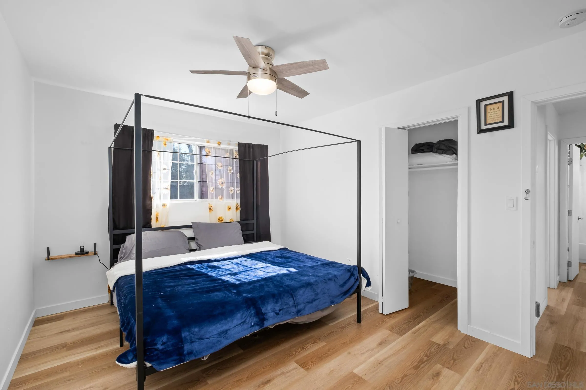 9651 Maccool Lane Santee, CA 92071 - Photo 21 of 32 a bedroom with a bed dresser and a window