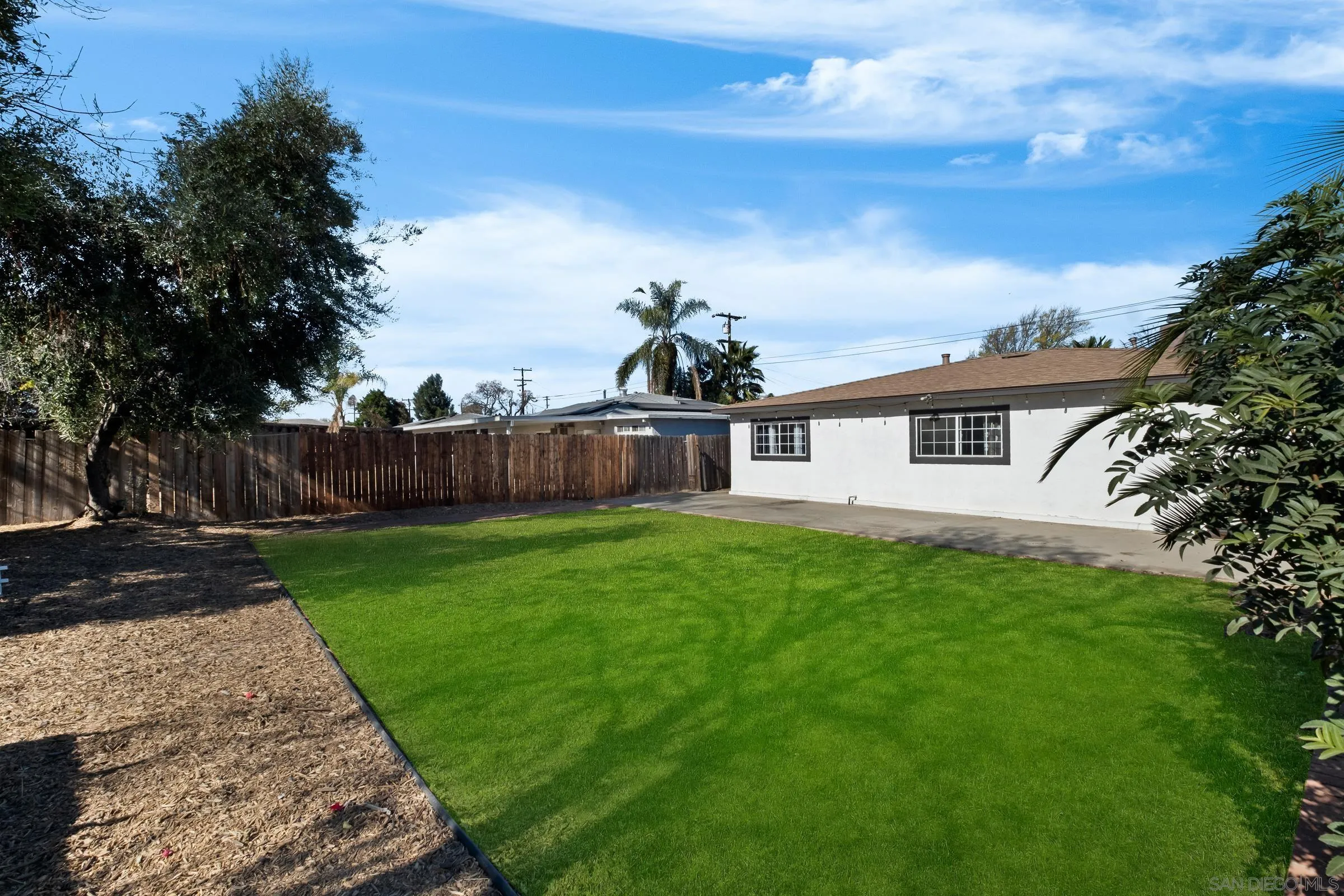 9651 Maccool Lane Santee, CA 92071 - Photo 27 of 32 a front view of a house with garden