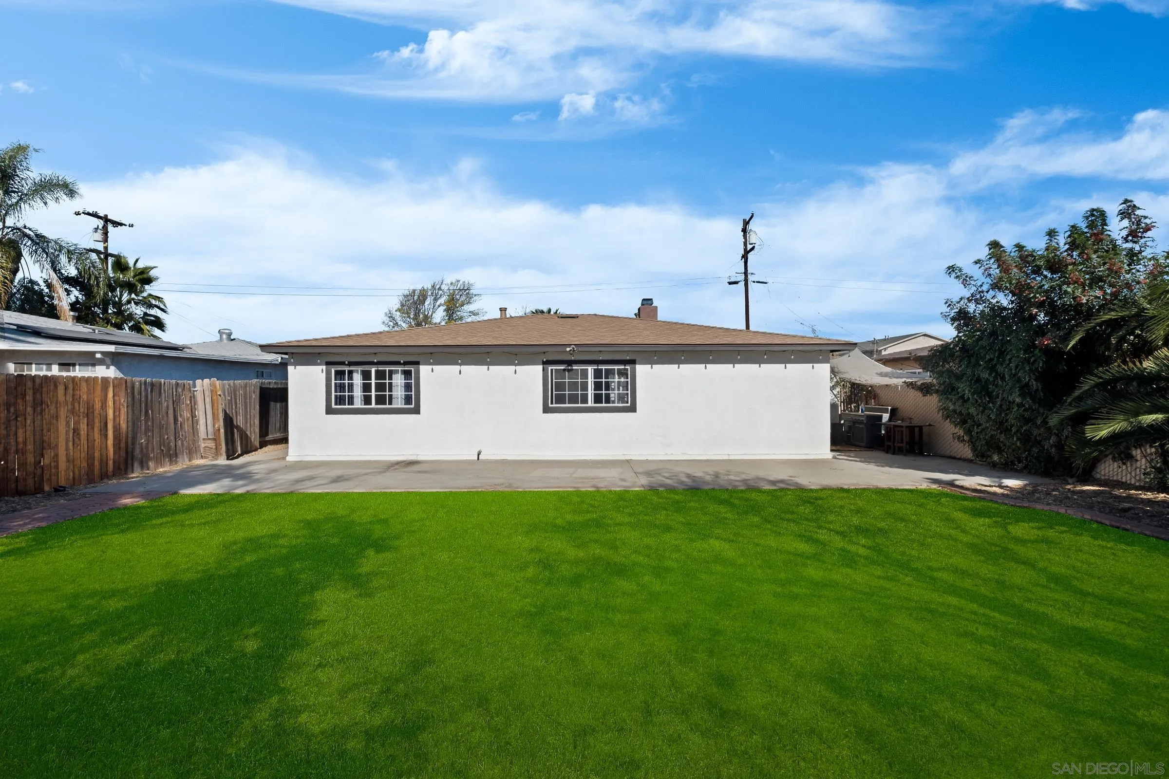 9651 Maccool Lane Santee, CA 92071 - Photo 29 of 32 a view of a yard in front of a house with a large tree