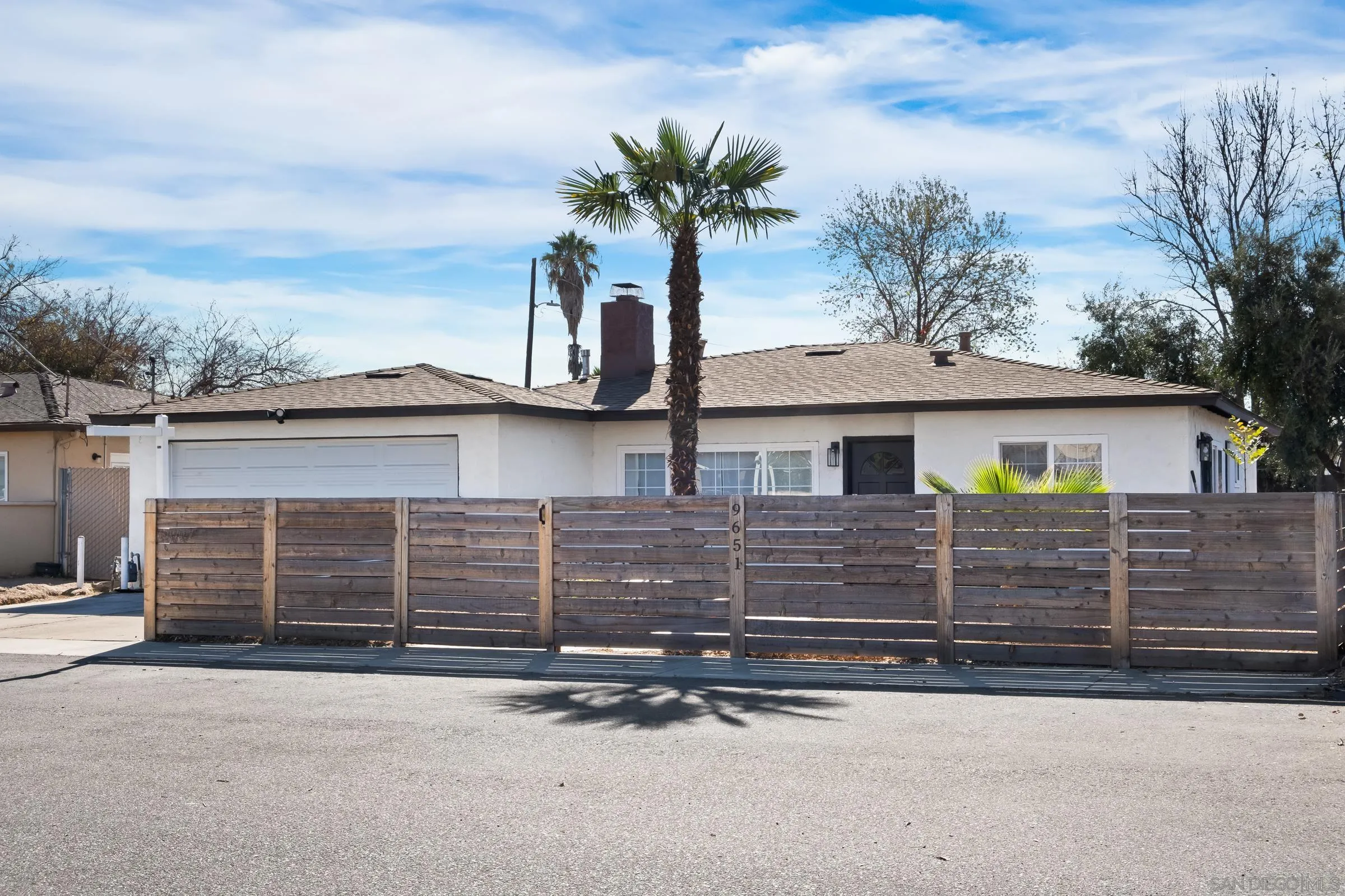 9651 Maccool Lane Santee, CA 92071 - Photo 5 of 32 front view of a house with a street
