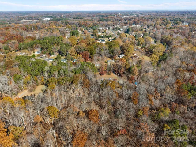 an aerial view of town with residential houses and trees
