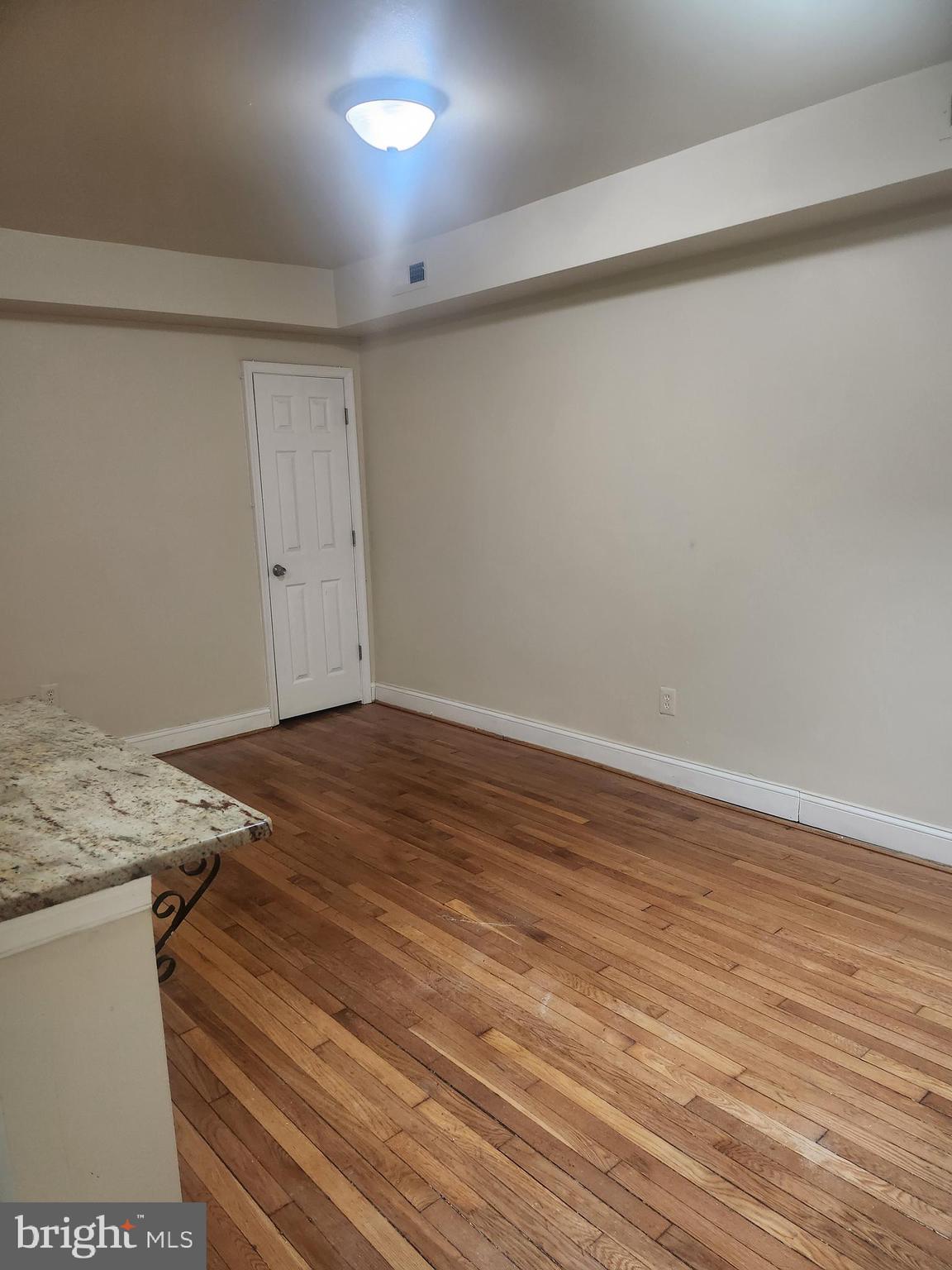 1601 E Street Northeast Washington, DC 20002 - Photo 4 of 10 a view of a room with wooden floor